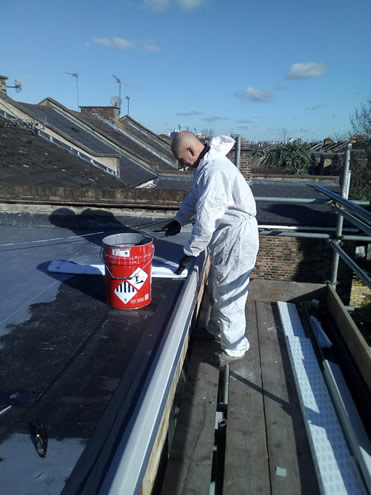 Anton repairing a flat roof in Brixton London